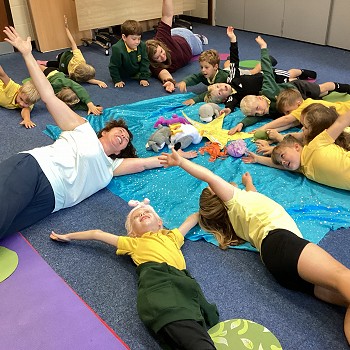 children and author doing yoga