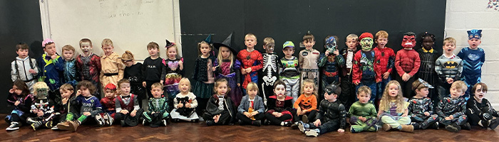 Children nursery and reception class wearing their halloween outfits