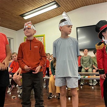 Four children have dressed up as part of thei assembly