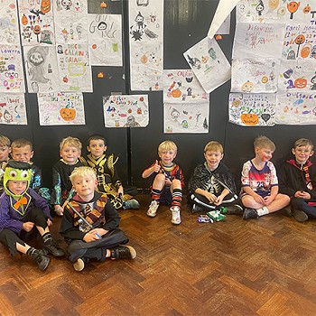 Group of boys dressed up as part of their halloween disco