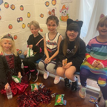 Five girls have dressed up for their halloween disco