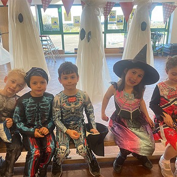 Five children have dressed up as difference characters for their halloween disco