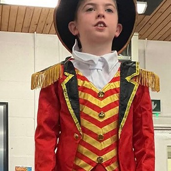 A child singing while wearinga pirates outfit
